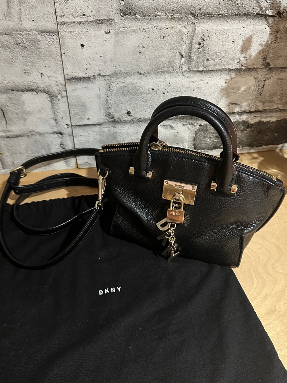 DKNY Black Pebbled Leather Mini Satchel with Gold-Tone Hardware and DKNY Charm